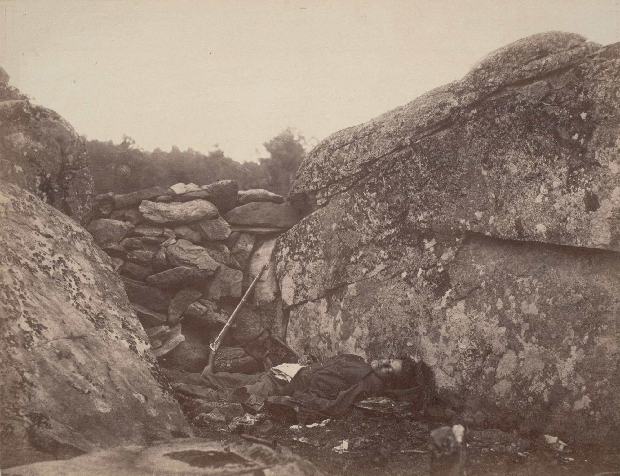 Alexander Gardner, Home of a Rebel Sharpshooter, 1863 — the soldier's body was moved and posed for the composition
